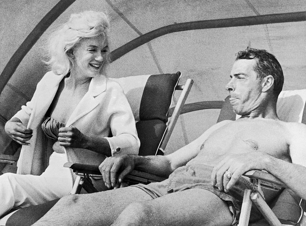 Marilyn Monroe and Joe DiMaggio on the Beach. Marilyn is here for a short vacation and Joe is here as a New York Yankee spring training coach.