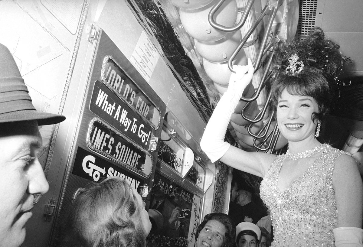 Actress Shirley MacLaine rides the New York subway on her way to the World's Fair for the premiere of her film "What A Way to Go" on May 13, 1964.