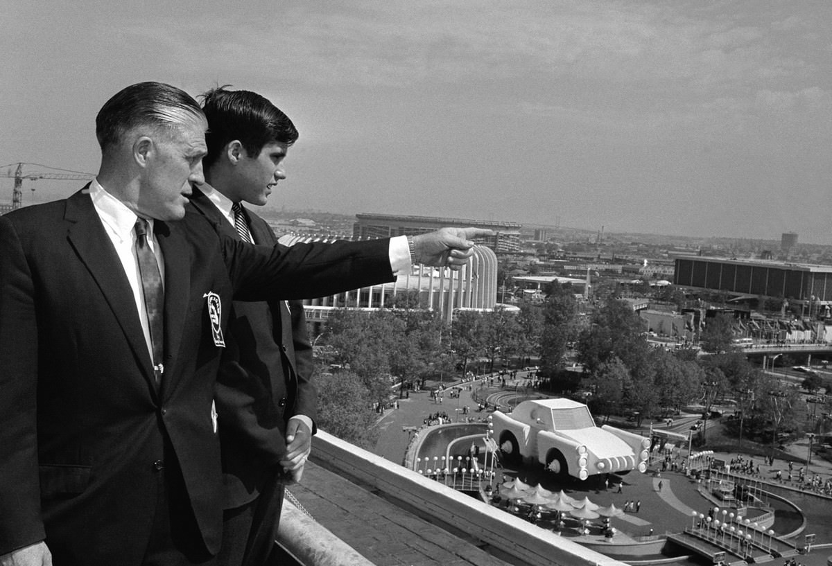 Michigan Governor George Romney and his son, Mitt, look out over the New York World's Fair grounds.