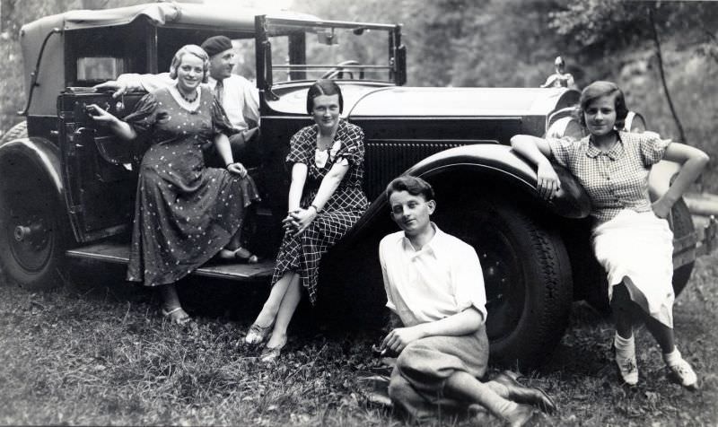 Five members of a well-to-do German family posing with a 1929 Packard Convertible Sedan in the countryside.