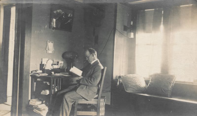 Man reading a book in his office