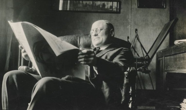 Man reads a magazine in his office