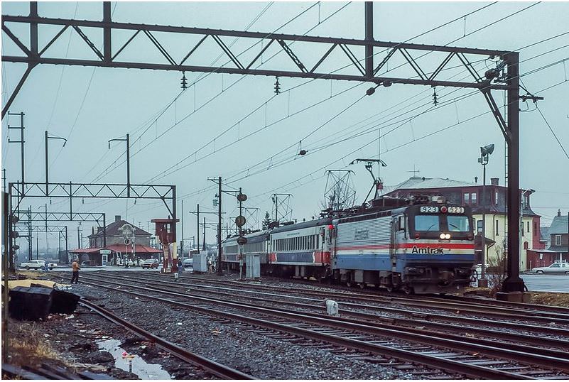 SEPTA’s AEM7 test train has been reconfigured to point south, and is now leaving Lansdale to return to Philadelphia, 1980s