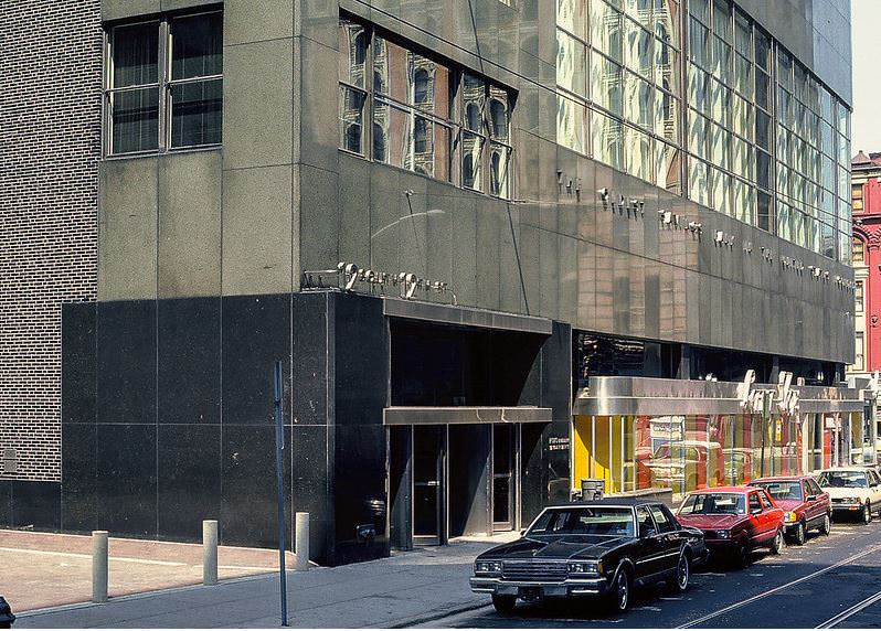 Street-level view along 12th Street with the office building entrance in the foreground.