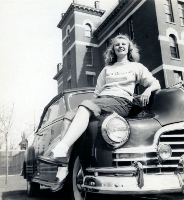 A young blonde lady posing on the fender of a 1946 Pontiac Torpedo Convertible, 1948
