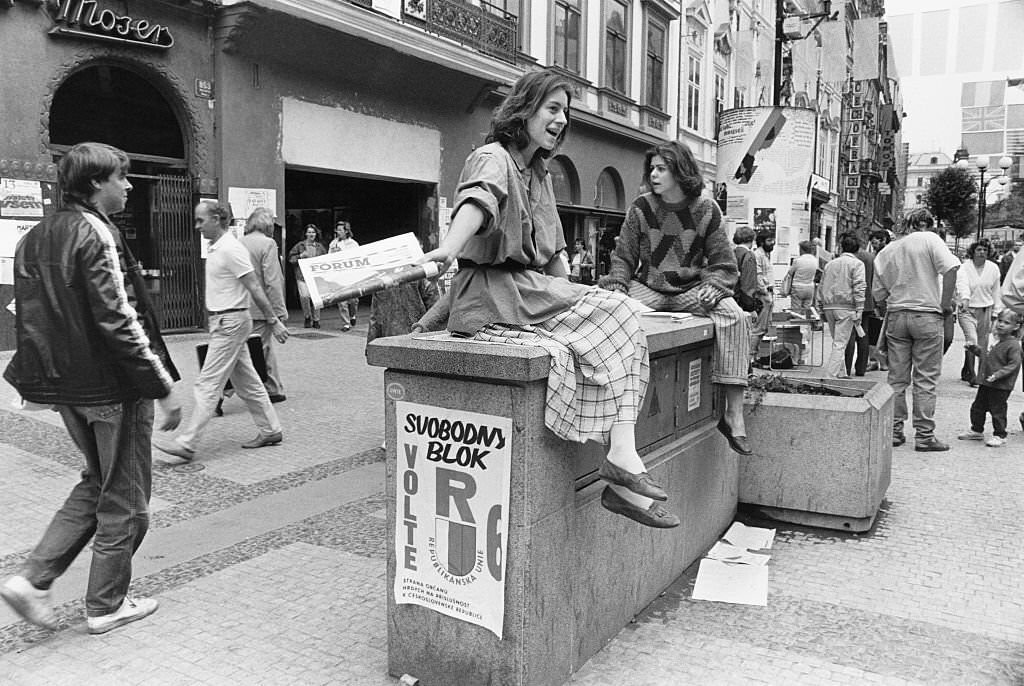 Young women distributing the political newspaper 'Forum' in Prague, Czechoslovakia, 6th June 1990.