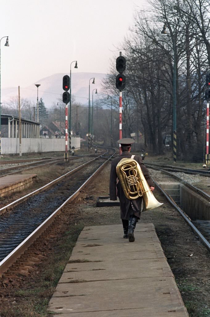 A Soviet soldier carrying a tuba returns th his barracks in Frenstat, 350 kilometers east of Prague.