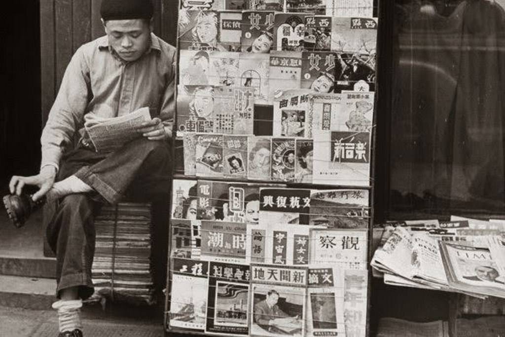 A newsstand on the side of a Shanghai street. Other than local newspapers and periodicals.