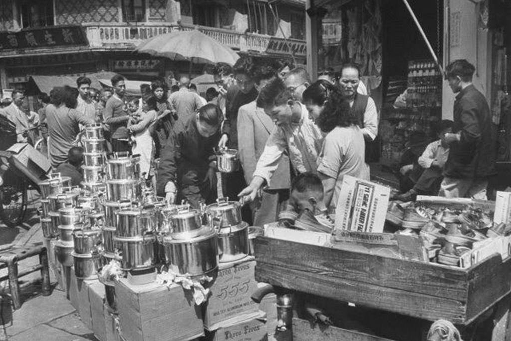 The Shanghai market bazaar, vendors selling “555″ branded pots. Soon after on May 14, 1940s