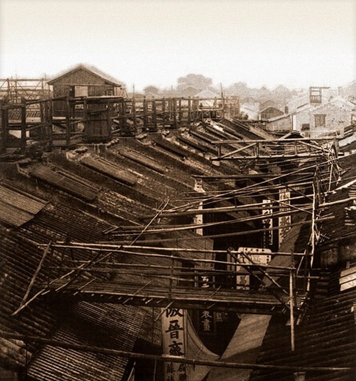 Bridges by which the night police of the roofs cross the streets, Canton, China, 1900