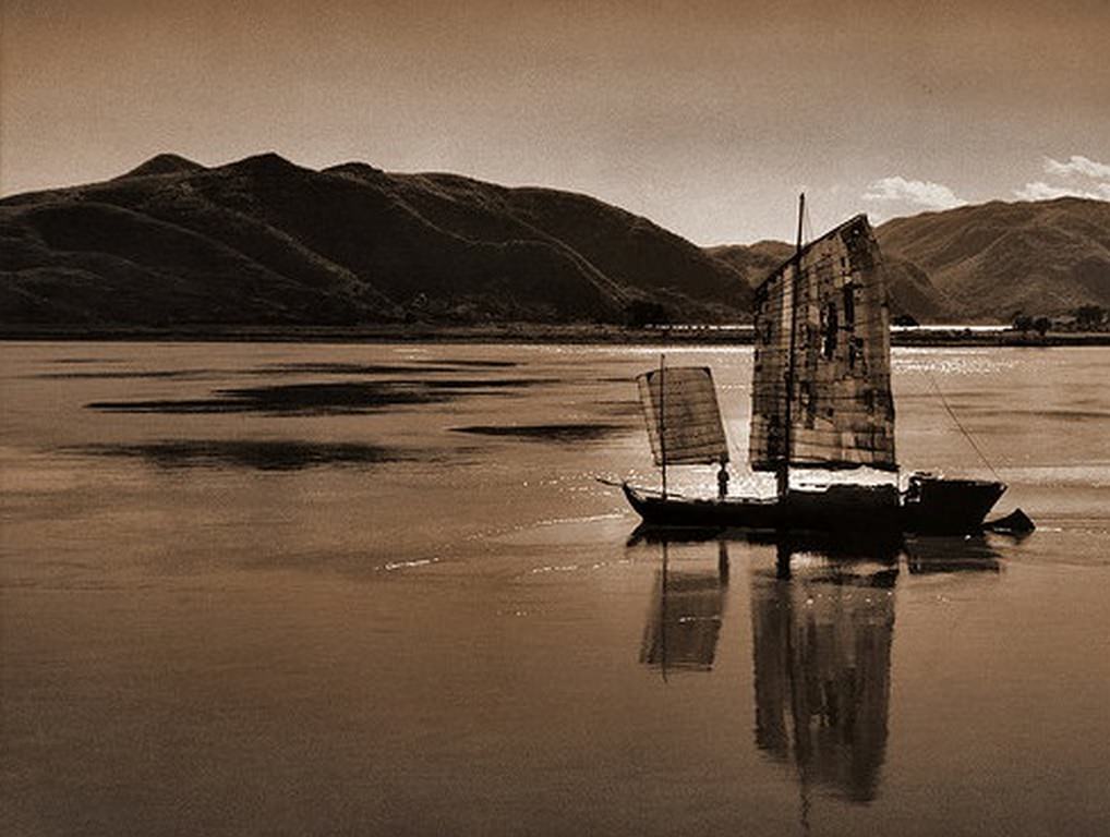 A Boat on a River With Rolling Hills in the Background in the Kiangsu Province or Yunnan Province, China, 1946