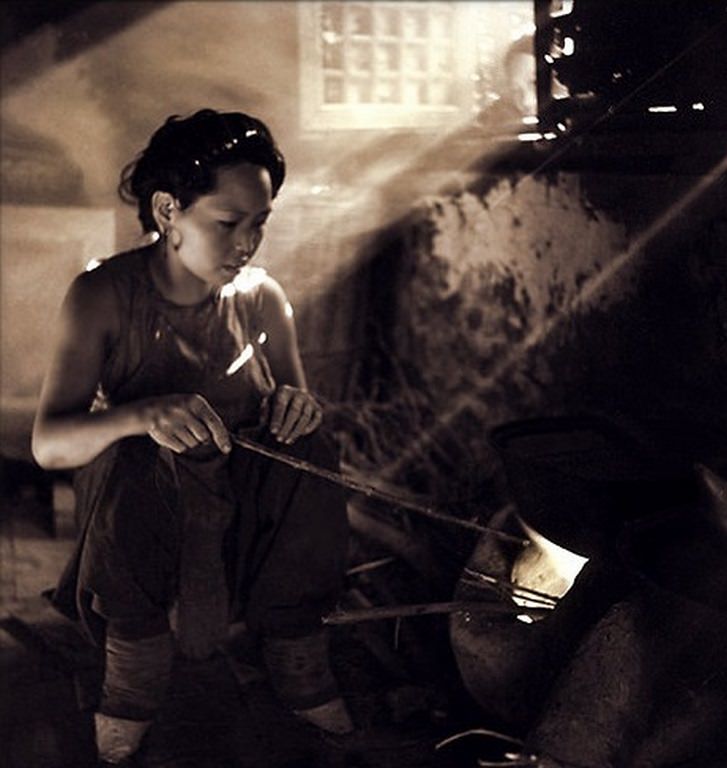 House Interior Showing Woman With Bound Feet Tending a Stove in the Lost Tribe Country, 1936