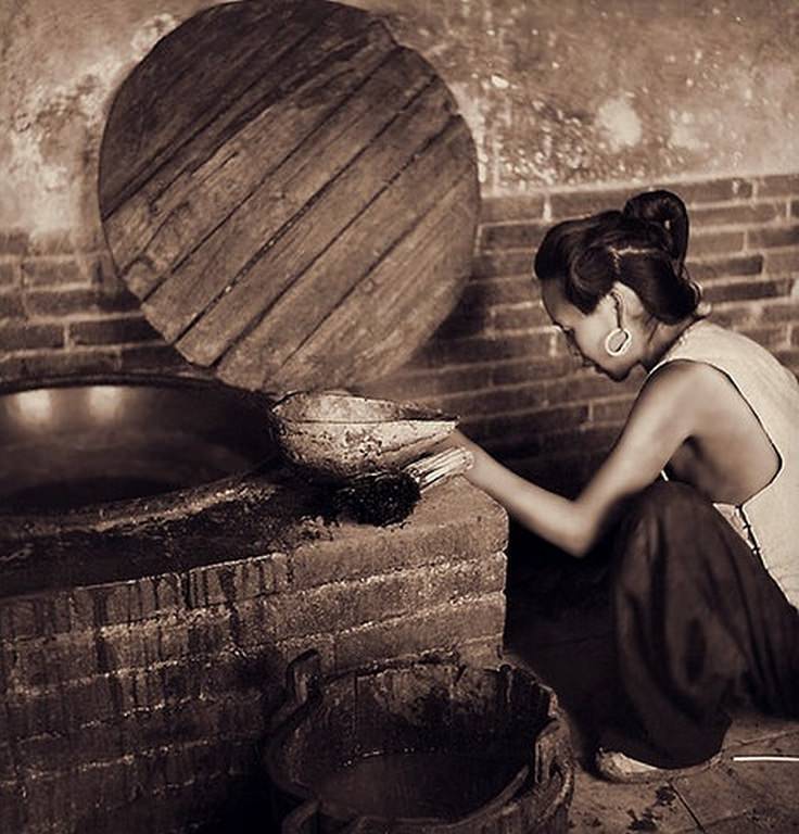 House Interior Showing a Woman at a Brick Stove, a Bucket & a Ladle Made From a Gourd in the Lost Tribe Country, 1936