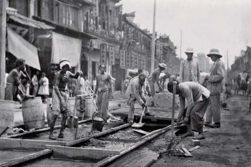Workers for The Shanghai Electric Construction Co. Ltd. on Nanjing Road laying streetcar trolley rails, 1907