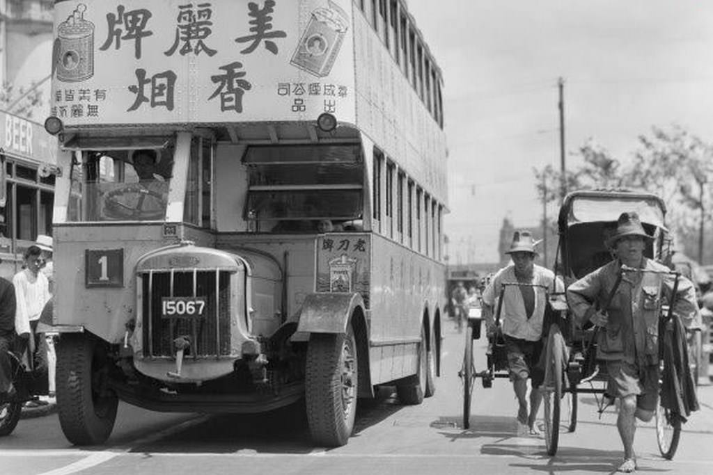 Shanghai Bund in 1935, where public buses were “invaded and taken over” by all types of advertisements.