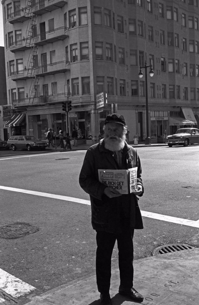 An old man with newspapers "The Rich Get Richer", The Tenderloin, San Francisco, 1975