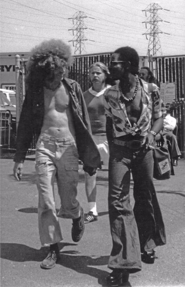 Men walking on street in San Francisco, 1973