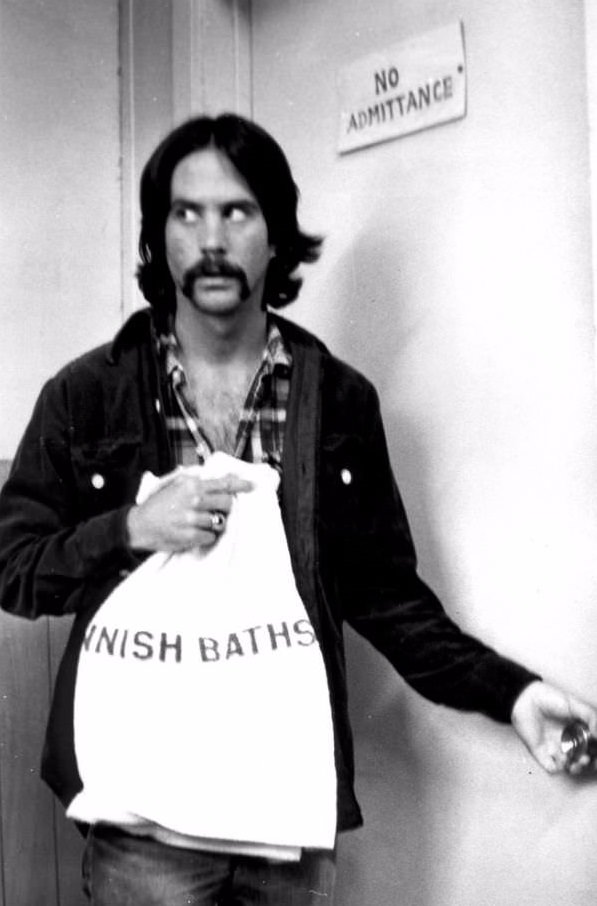 Man with Finnella's Finnish Baths towel, sneaking into forbidden zone, San Francisco, 1978