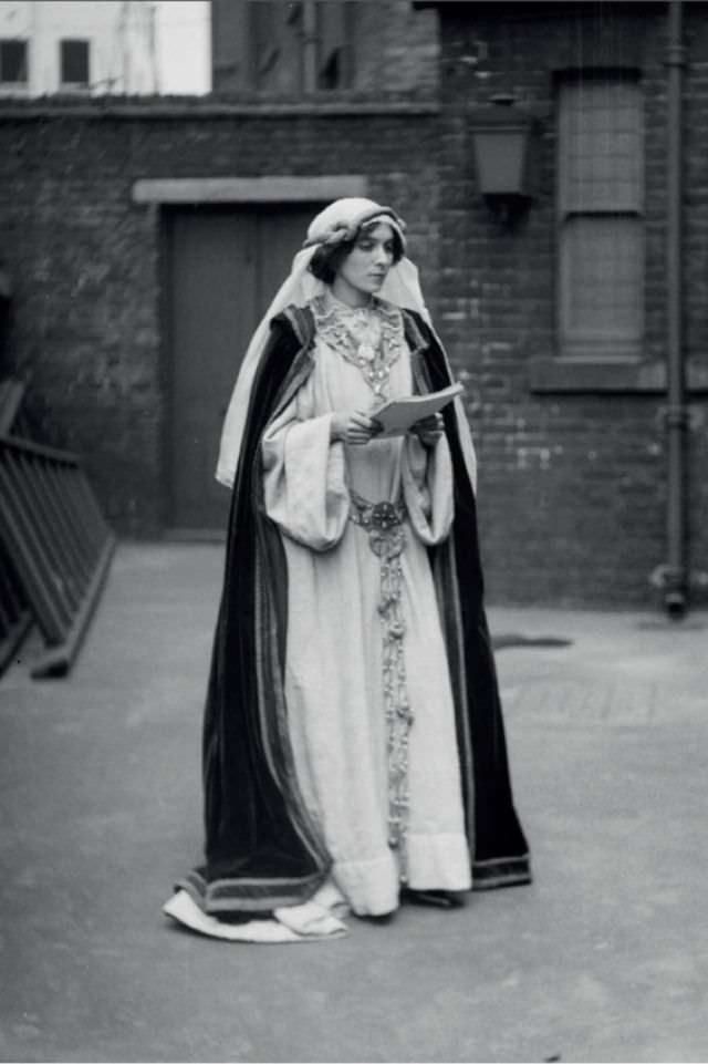 A suffragette in historic costume at the Green, White, & Gold Fair organized by the Women’s Freedom League, 1909