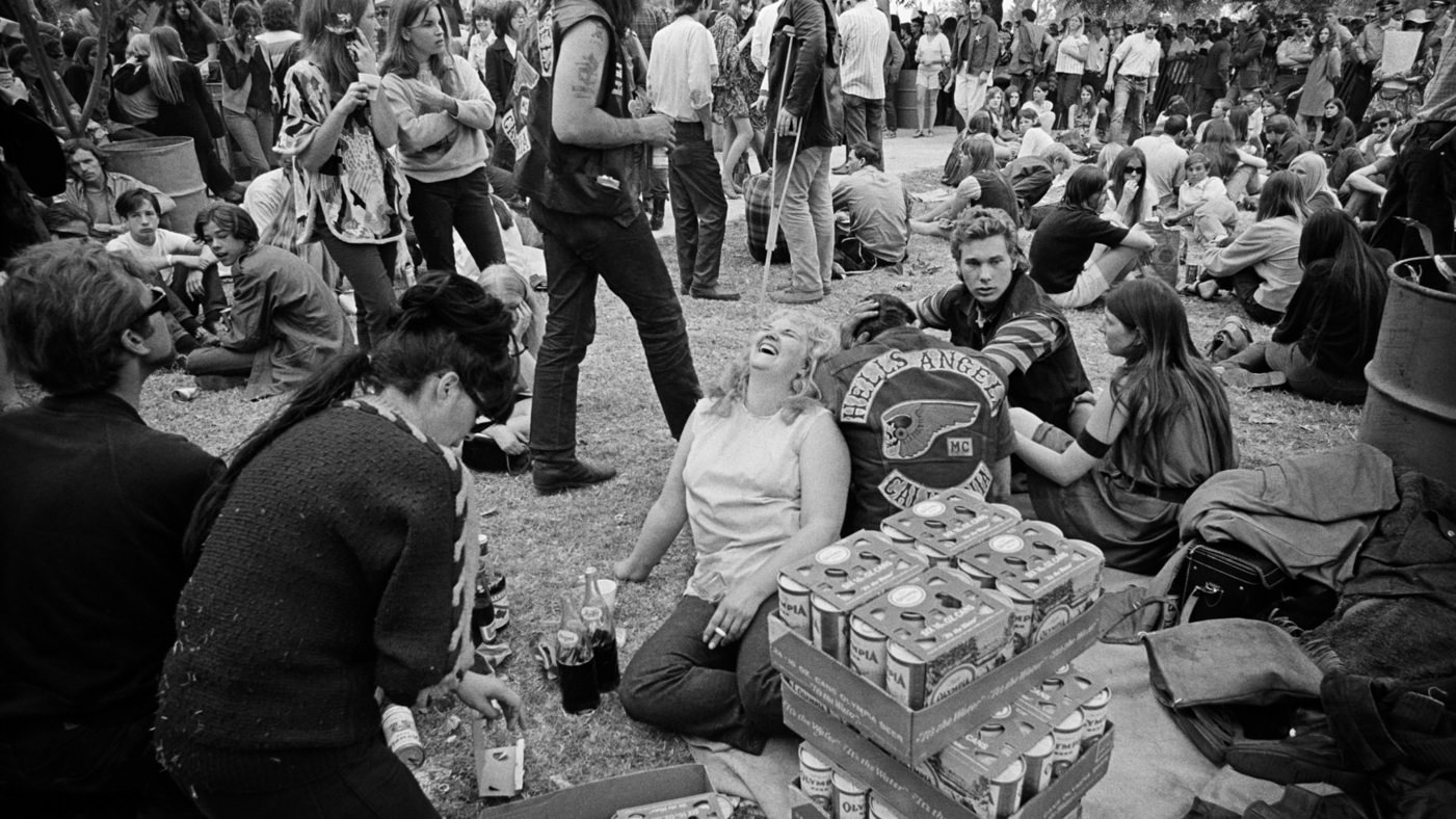 Hippies and Hells Angels hang out together in Golden Gate Park in 1968.