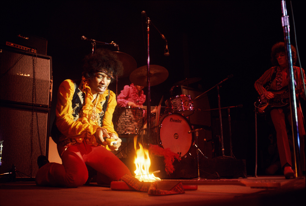 Jimi Hendrix lighting his guitar on fire on stage at Monterey International Pop Festival Monterey, California, June 1967.