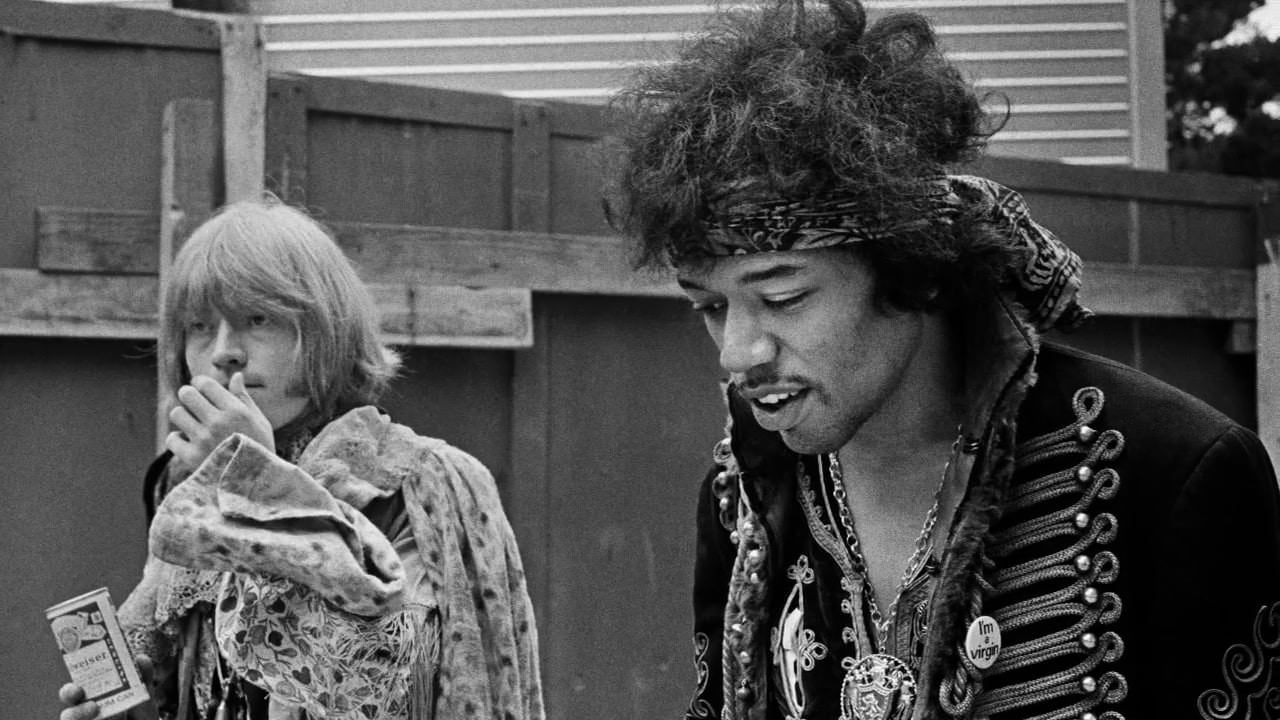 Brian Jones and Jimi Hendrix backstage at the Monterey Pop Festival, 1967.