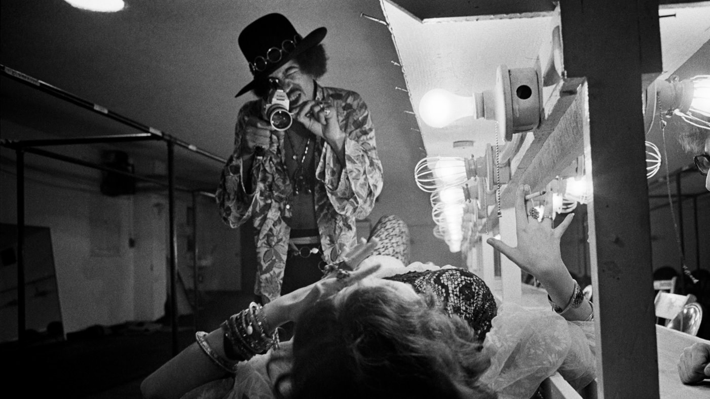 Jimi Hendrix filming Janis Joplin backstage at Winterland in 1968.