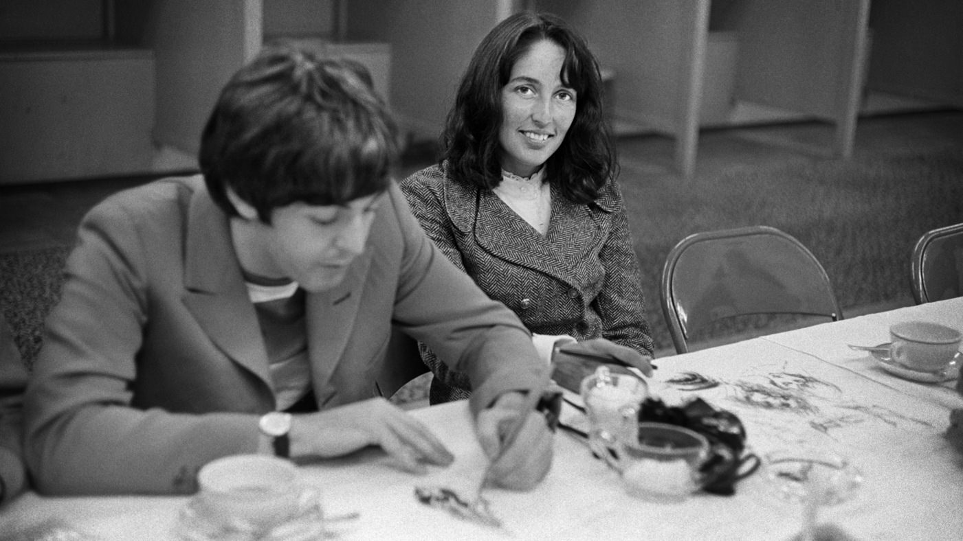 Joan Baez and Paul McCartney doodling backstage at Candlestick Park in 1966.