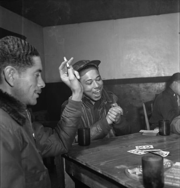 Tuskegee airmen playing cards in the officers' club in the evening