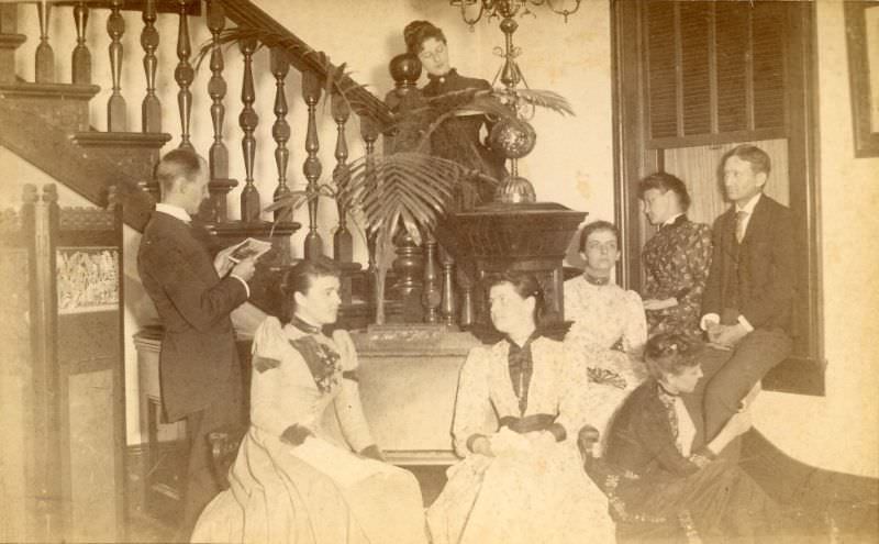 People seated on and by staircase