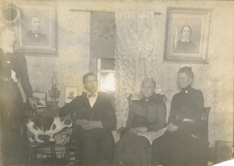 Family seated in front of window