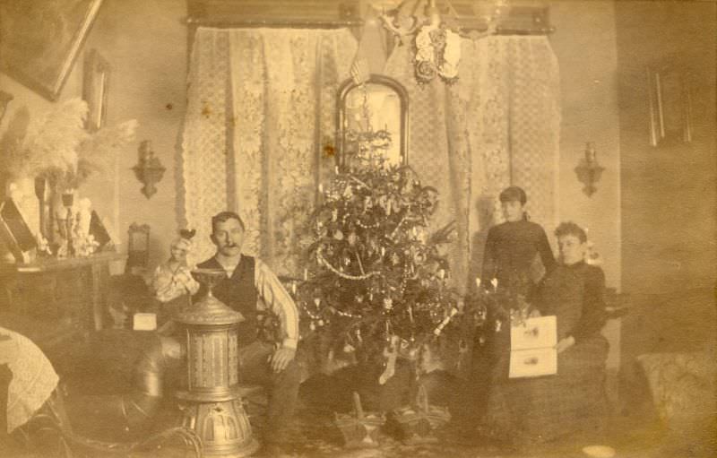 Family grouped around Christmas tree