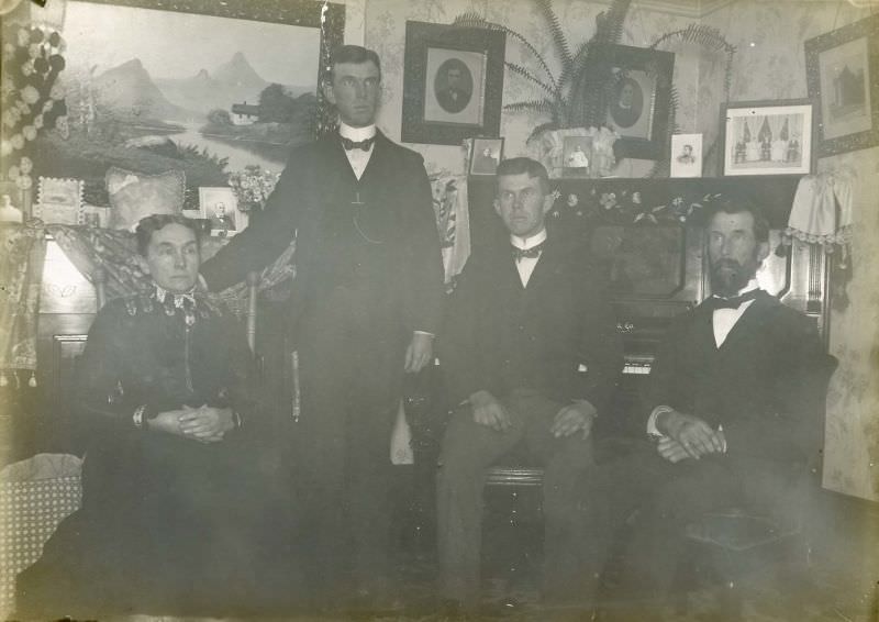 Family seated in front of piano