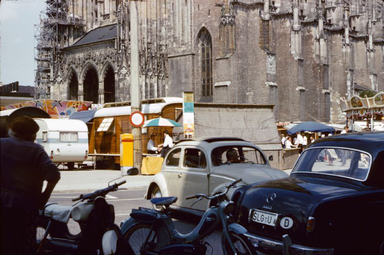 A carnival set up in front of the Minster in Ulm, 1960s