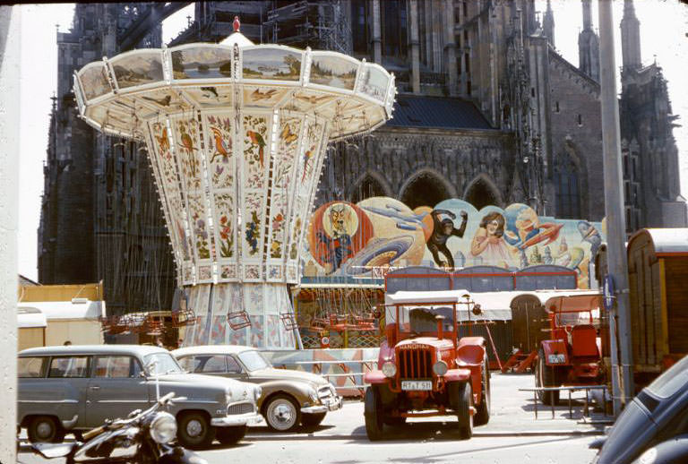A carnival set up in front of the Minster in Ulm, 1960s