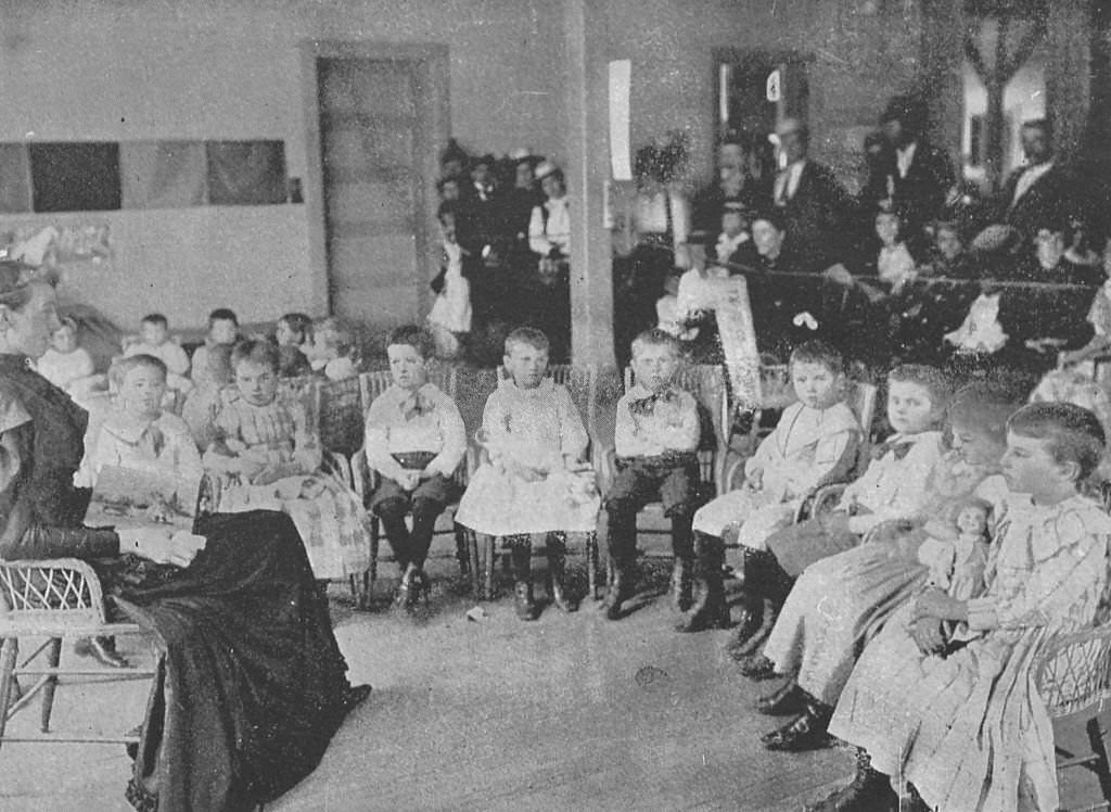 Oral instruction being given to Deaf Mutes at the World's Columbian Exposition in Chicago, Illinois, 1893.