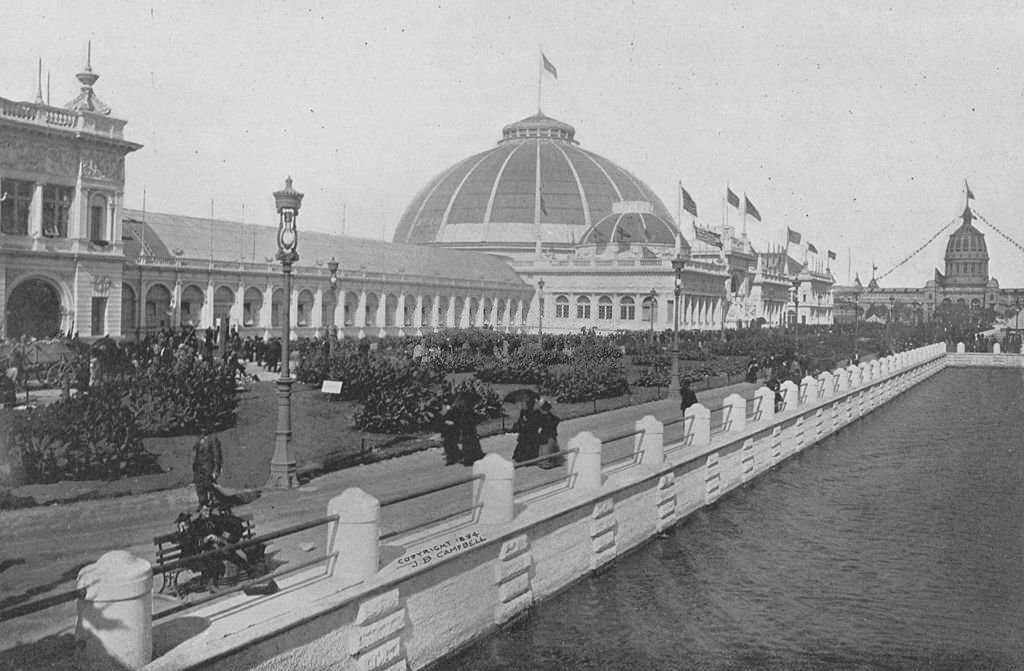 The Horticultural Building and grounds fronting the Lagoon Plaza covered with plants and flowers at the World's Columbian Exposition in Chicago, 1893.