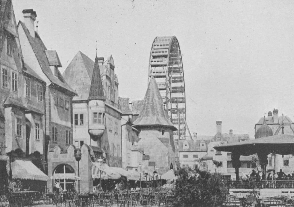 An interior view of the Street of Vienna and Ferris Wheel at the Midway Plaisance during the World's Columbian Exposition in Chicago, 1893.