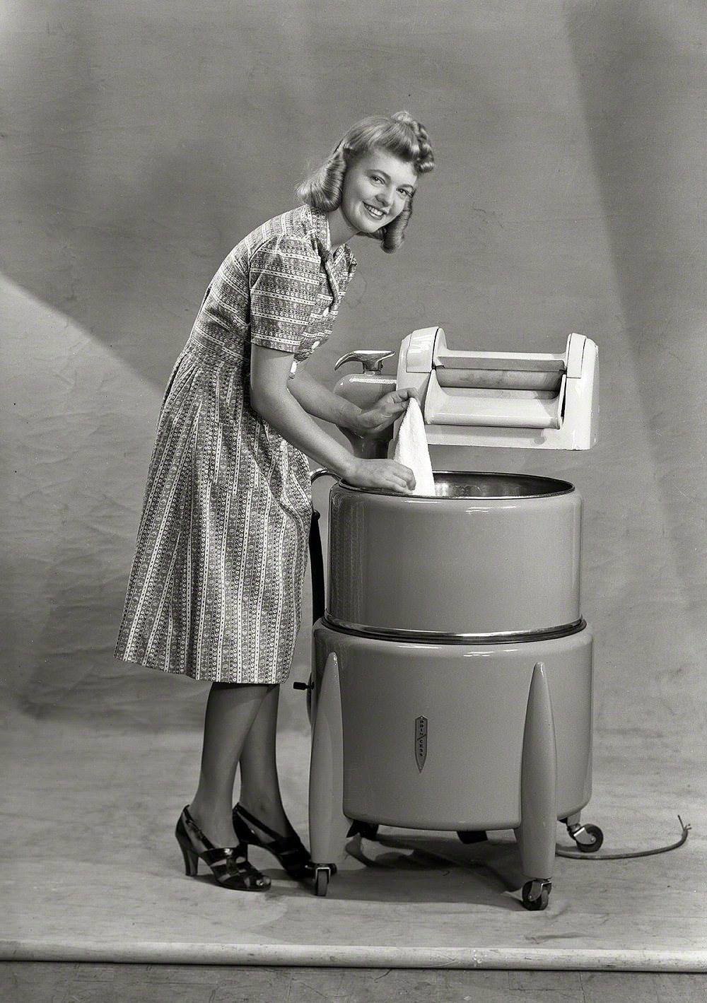 Model with wringer washing machine, New Zealand circa 1950s