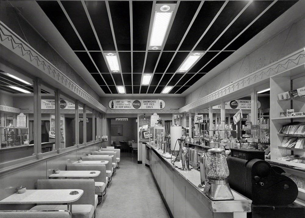 Interior of Sunshine Milk Bar lined with booths, Whanganui, New Zealand, 1950
