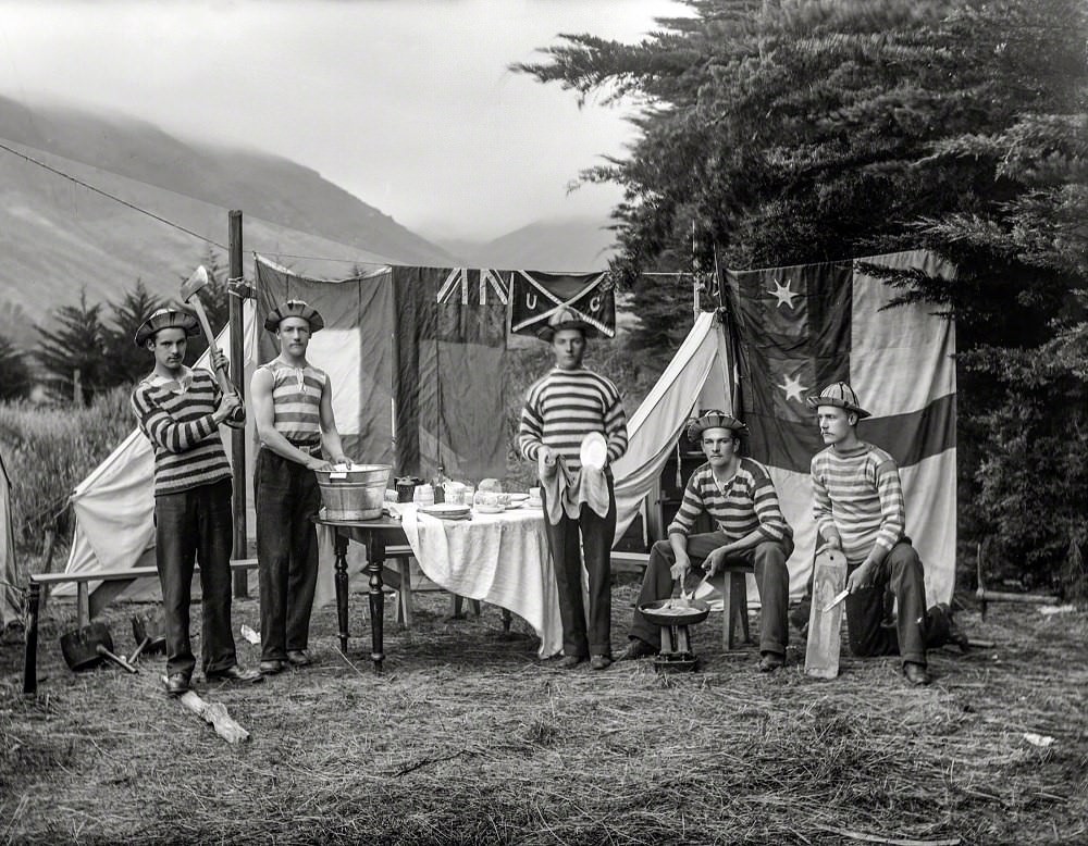 Men doing chores at a campsite, all in striped tops, poss­ibly Sumner, Christchurch, New Zealand circa 1905