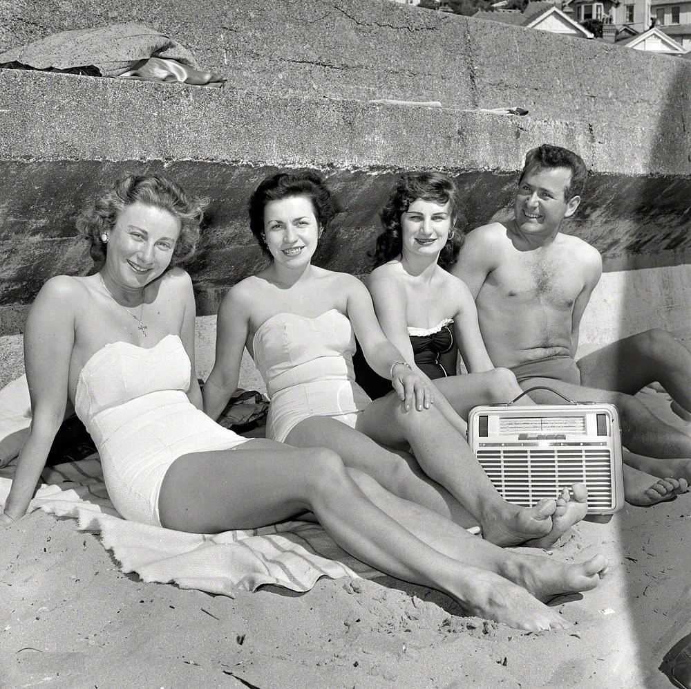 Swimmers listening to radio and relaxing at Oriental Bay Beach, Wellington, New Zealand, 1958