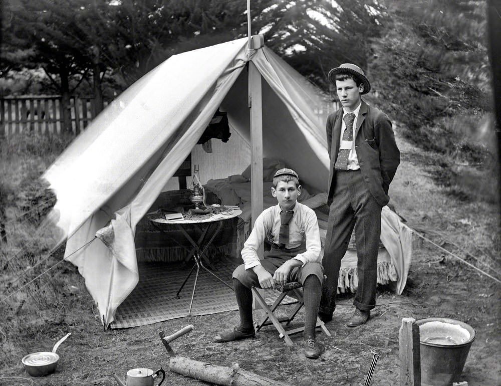 Male youths outside tent, Christchurch district, New Zealand circa 1905