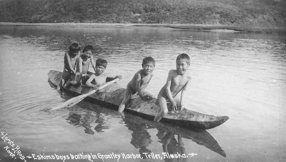 Eskimo boys on a kayak in Grantley Harbor.