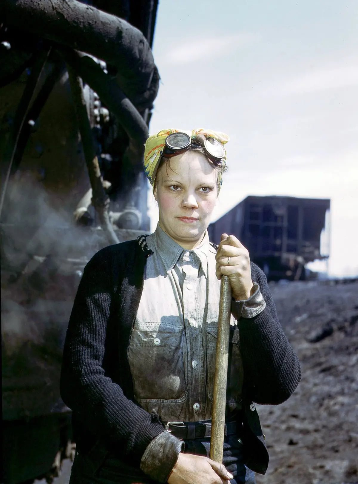 Mrs. Irene Bracker, mother of two, a wiper at the roundhouse.