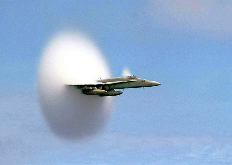 A U.S. Navy plane travels through a flow-induced vaporization off the coast of South Korea on July 7, 1999.