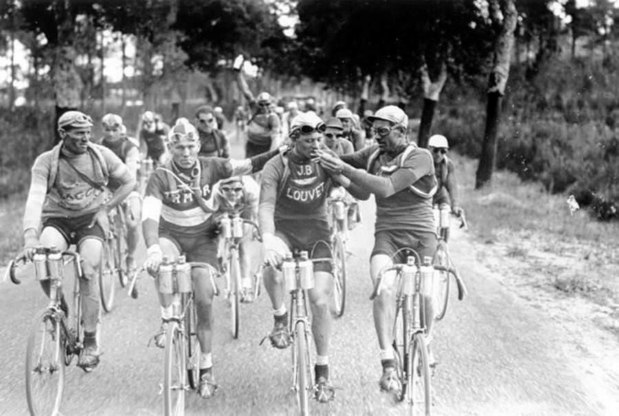 Cyclists smoke cigarettes while competing in the 1927 Tour de France.