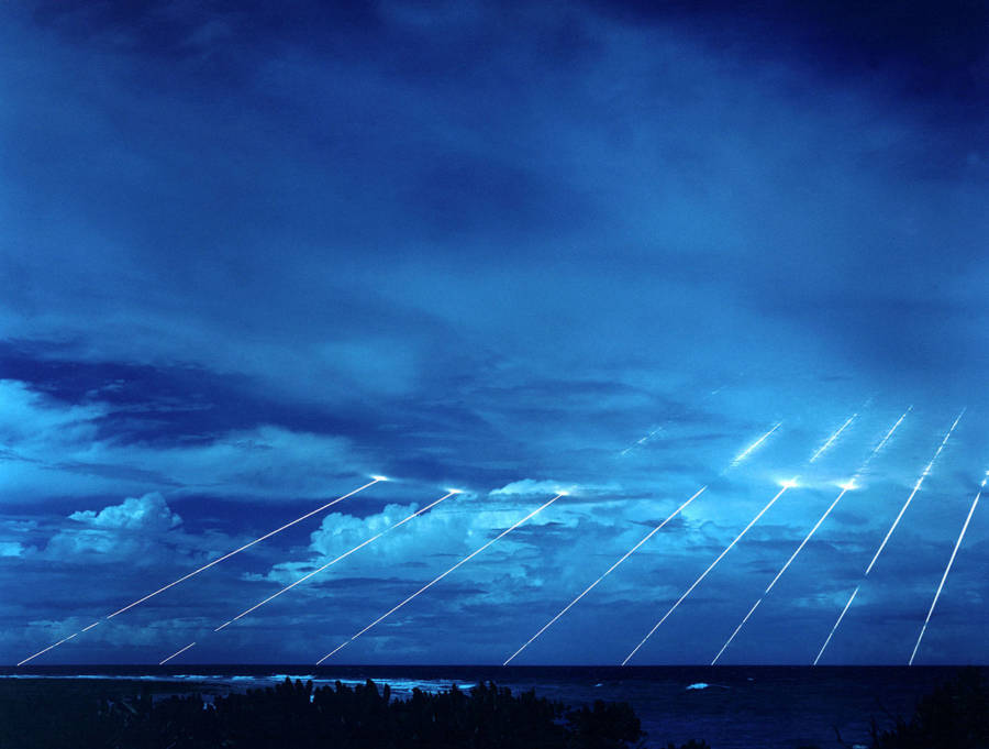 Eight beams from the American nuclear missile known as the Peacekeeper light up the skies above Kwajalein Atoll in the Marshall Islands during a test launch in 1984.