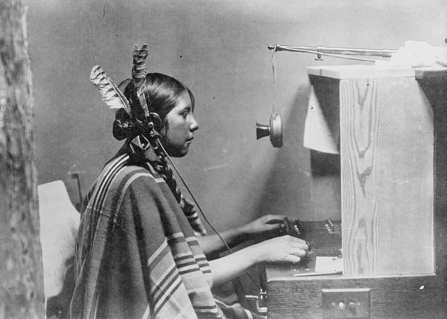 A Native American telephone switchboard operator sits at work at Montana's Many Glacier Hotel on June 26, 1925.