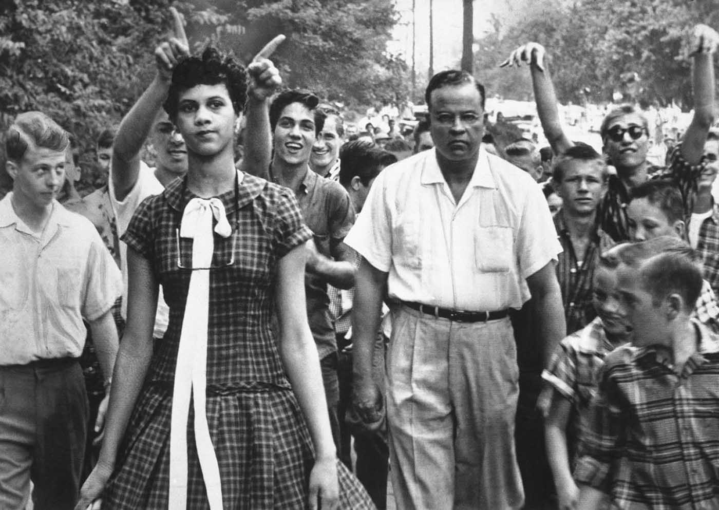 Dorothy Counts, 15, is taunted and harassed by white students as she makes her way from Harding High School in Charlotte, North Carolina.